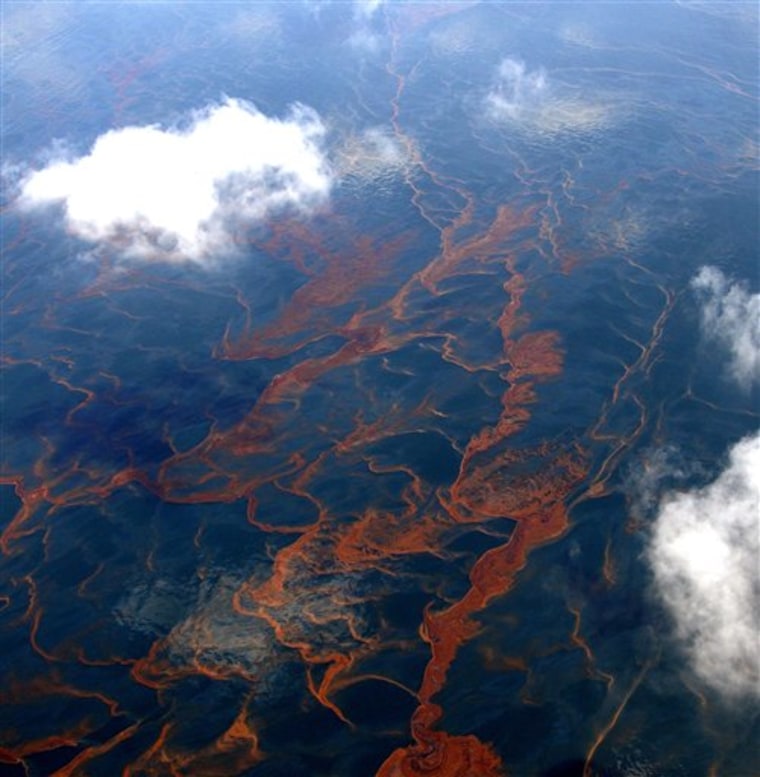 FILE - In this May 6, 2010 file photo, massive sheens of oil are seen from an altitude of 3,500 feet over the Gulf of Mexico, off the coast of Louisiana. (AP Photo/David Quinn, File)